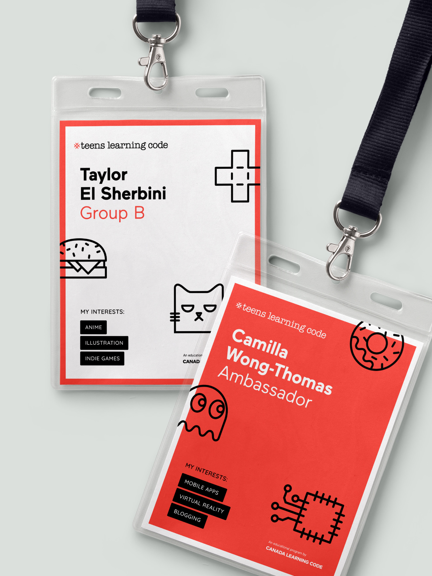 Printed event ID badges featuring identity typography and icons for Teens Learning Code