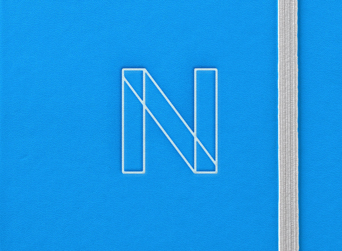 Branding on notebook showing logo icon design for Nascent Digital